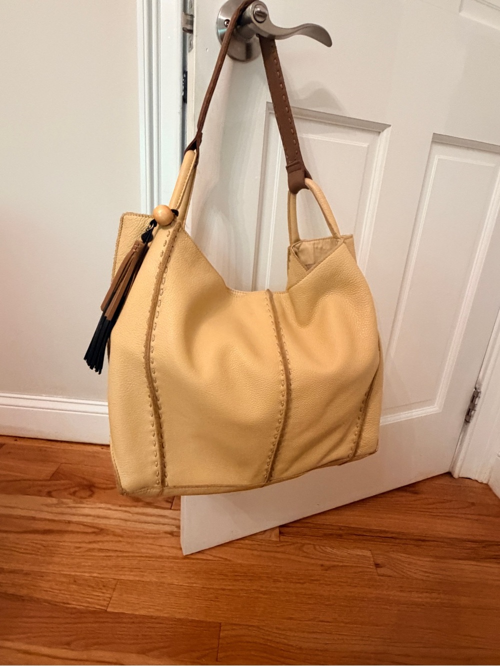 The Sak Los Feliz Yellow Leather Hobo Bag with Tassel Accent